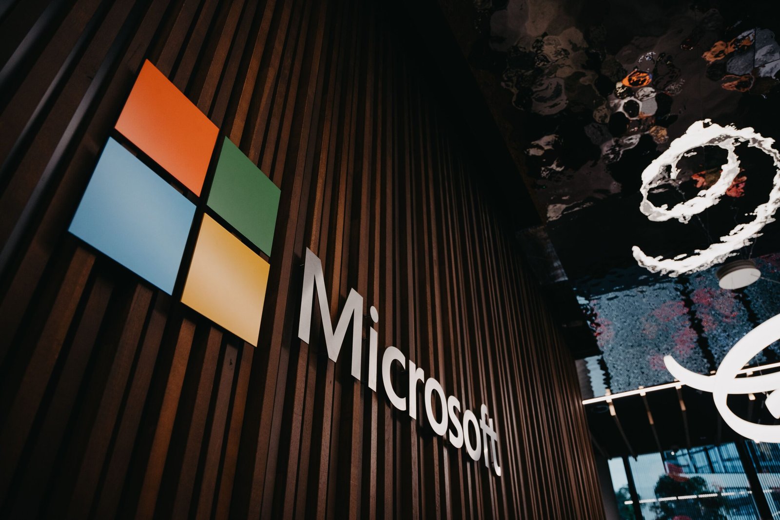 Home Interior view of Microsoft office with logo on wooden wall in Brussels, Belgium.